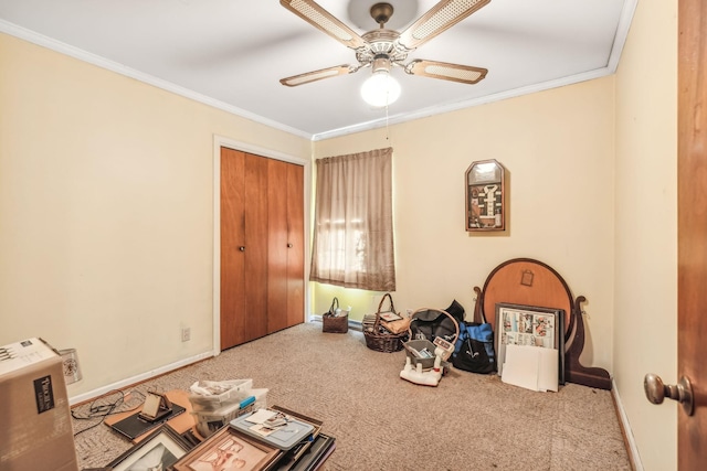 misc room with carpet flooring, ceiling fan, and ornamental molding