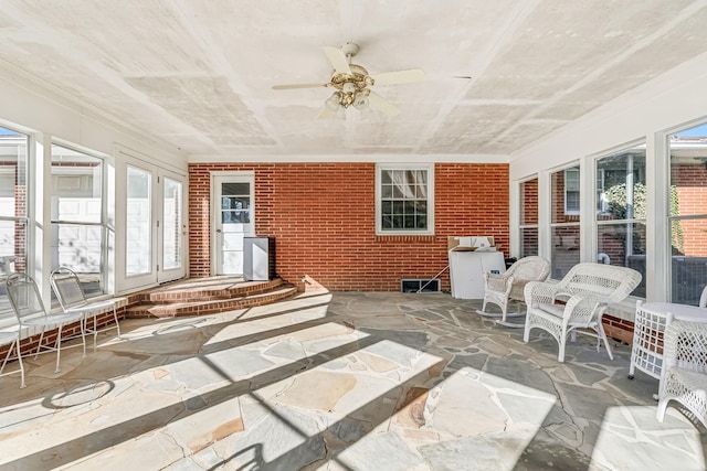 sunroom / solarium with ceiling fan