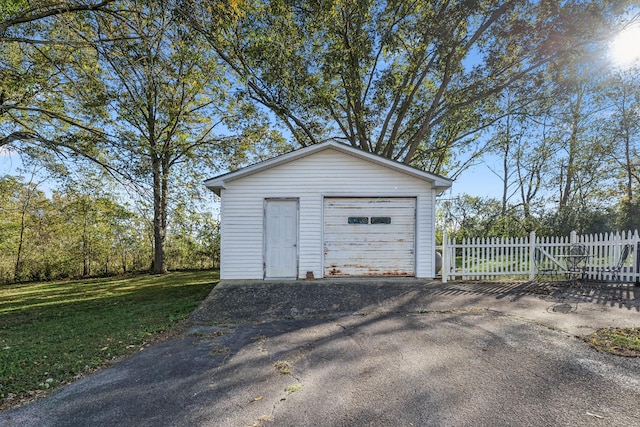 garage featuring a yard