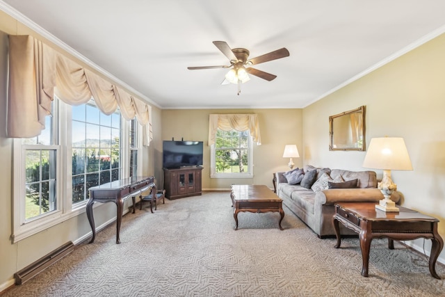 living room featuring ceiling fan, light colored carpet, and ornamental molding