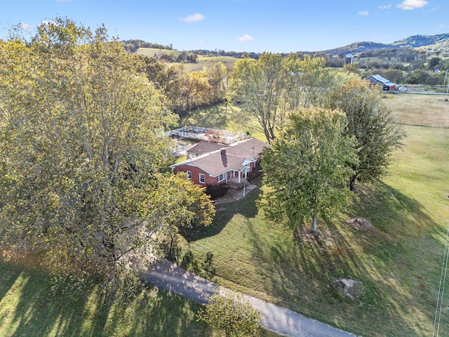 birds eye view of property with a mountain view