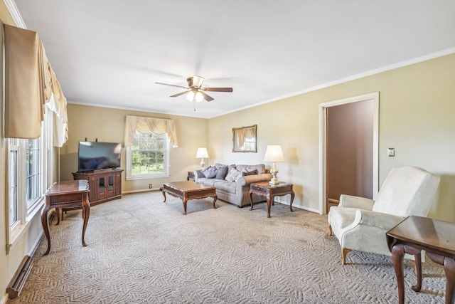 carpeted living room featuring ceiling fan and ornamental molding