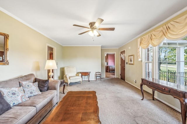 carpeted living room with ceiling fan and crown molding