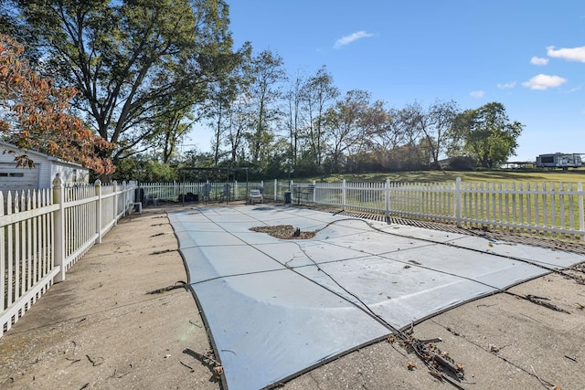 view of swimming pool with a patio