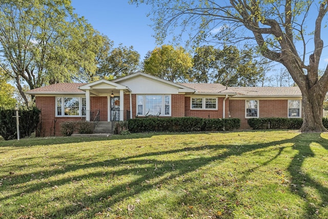 ranch-style home with a front yard