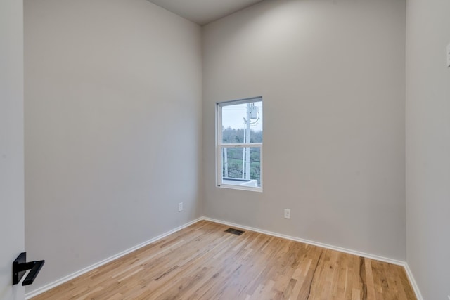 unfurnished room featuring light hardwood / wood-style flooring