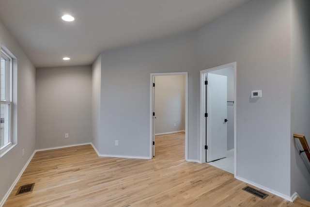 unfurnished room with light hardwood / wood-style flooring