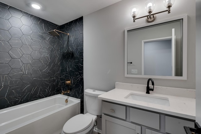 full bathroom with vanity, toilet, and tiled shower / bath