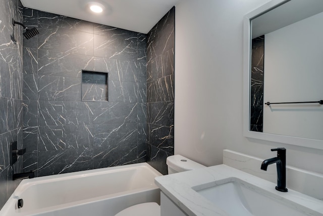 full bathroom featuring vanity, toilet, and tiled shower / bath