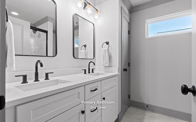 bathroom with vanity and walk in shower