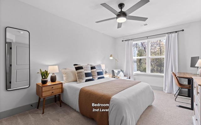 bedroom with ceiling fan and light carpet