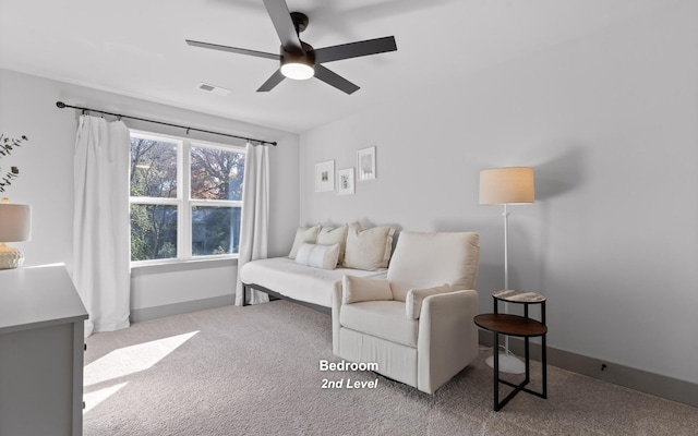 living room featuring ceiling fan and light colored carpet