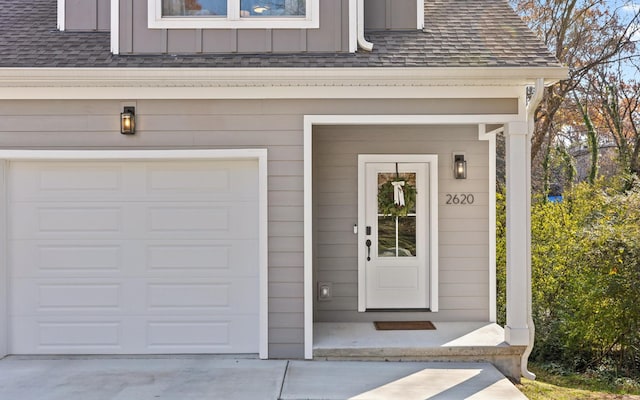 view of exterior entry featuring a garage