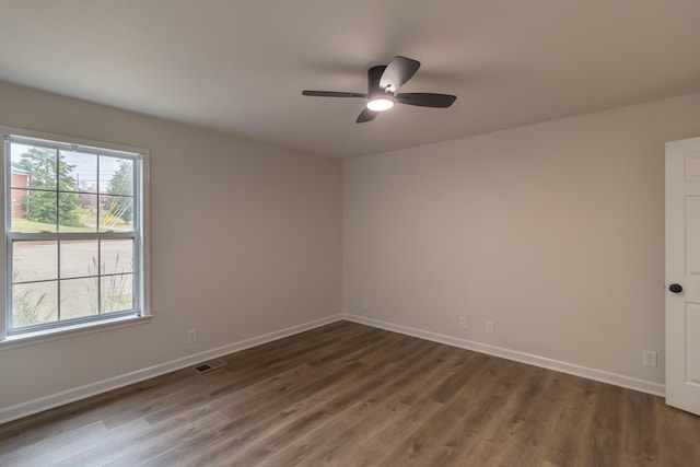 unfurnished room featuring ceiling fan and dark hardwood / wood-style floors