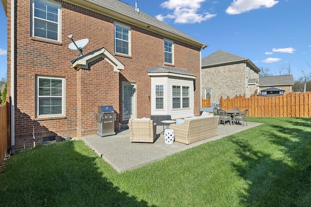 rear view of property with outdoor lounge area, a yard, and a patio area