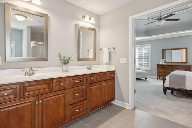 bathroom featuring tile patterned flooring, ceiling fan, and vanity