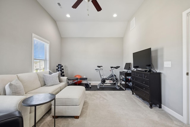 carpeted living room featuring ceiling fan and high vaulted ceiling