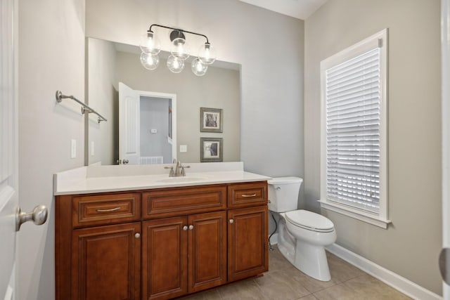 bathroom with tile patterned floors, vanity, and toilet