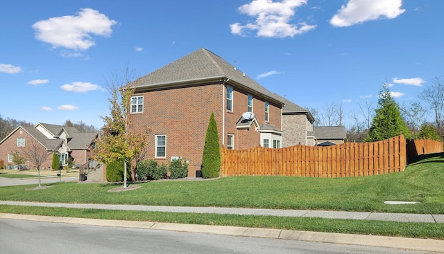 view of property exterior featuring a yard