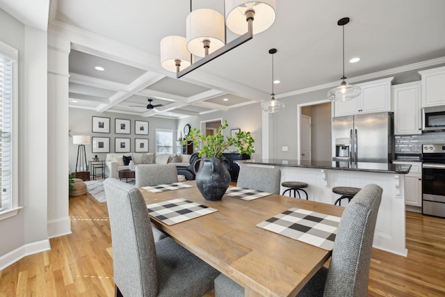 dining room featuring beam ceiling, ceiling fan, coffered ceiling, light wood-type flooring, and ornamental molding