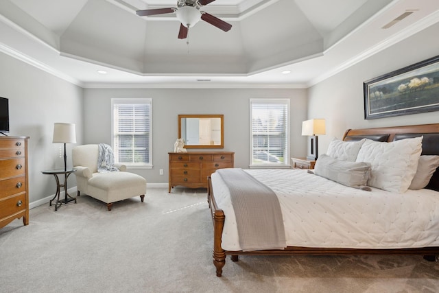 bedroom with ceiling fan, a raised ceiling, and carpet floors