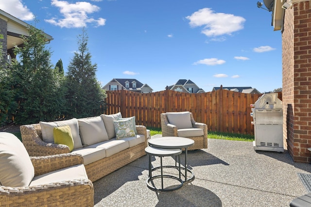 view of patio / terrace featuring a grill and an outdoor living space