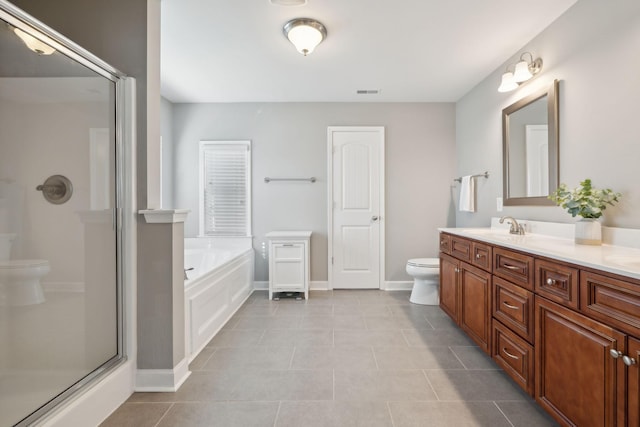 full bathroom featuring tile patterned flooring, vanity, separate shower and tub, and toilet