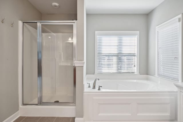 bathroom with tile patterned flooring, vanity, and independent shower and bath