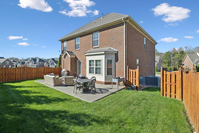 rear view of house featuring a lawn, a patio area, central air condition unit, and an outdoor hangout area