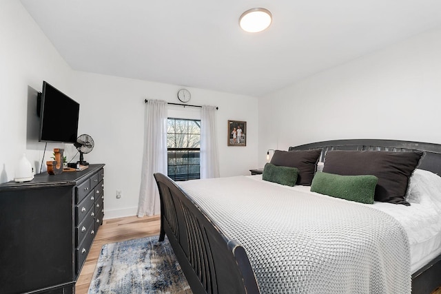 bedroom with light hardwood / wood-style floors