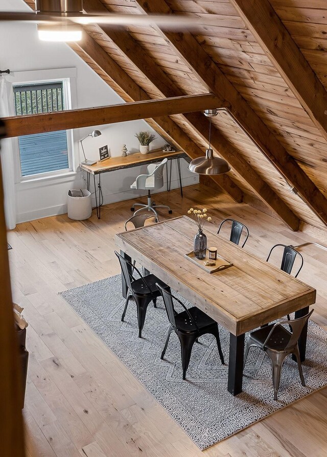 interior space with wood ceiling, light hardwood / wood-style flooring, and lofted ceiling with beams