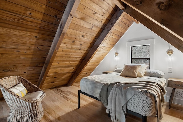 bedroom featuring wooden ceiling, lofted ceiling with beams, and light wood-type flooring