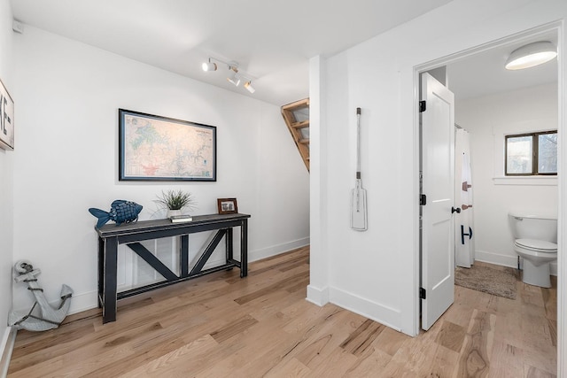 corridor featuring light hardwood / wood-style floors