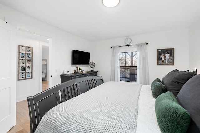 bedroom with light hardwood / wood-style flooring