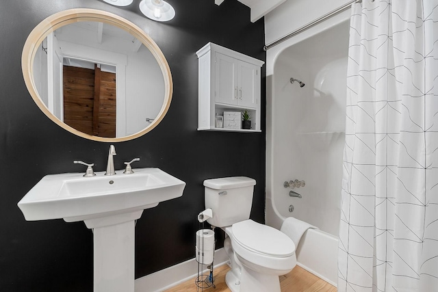 bathroom with shower / bath combination with curtain, toilet, and wood-type flooring