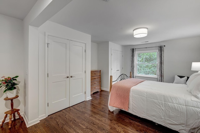 bedroom featuring dark wood-type flooring