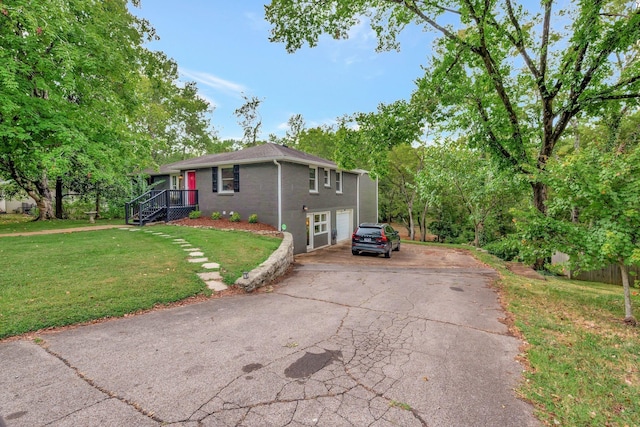 view of property exterior featuring a lawn and a garage