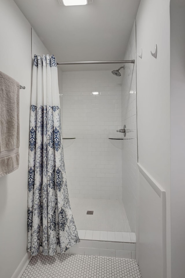 bathroom featuring tile patterned flooring and walk in shower