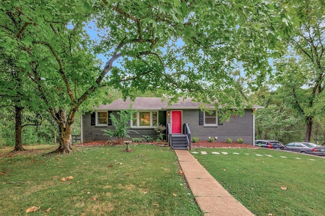 ranch-style house featuring a front lawn