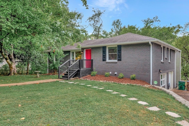 view of front of home with a garage and a front yard