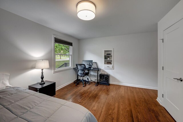 bedroom with hardwood / wood-style floors