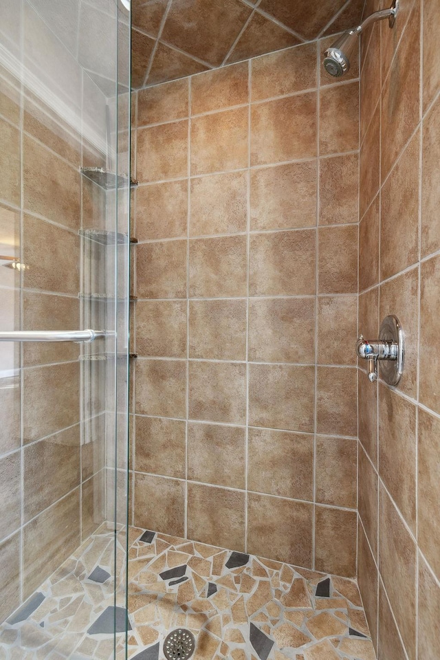 bathroom with a tile shower