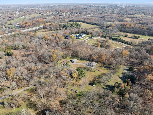 birds eye view of property with a rural view