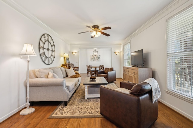 living room featuring crown molding, plenty of natural light, and dark wood-type flooring