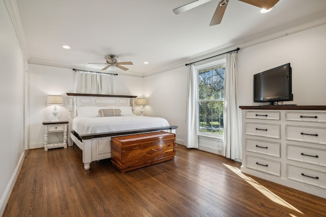 bedroom with ornamental molding, ceiling fan, and dark wood-type flooring