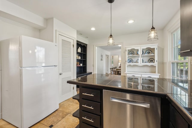 kitchen with pendant lighting, white fridge, and stainless steel dishwasher