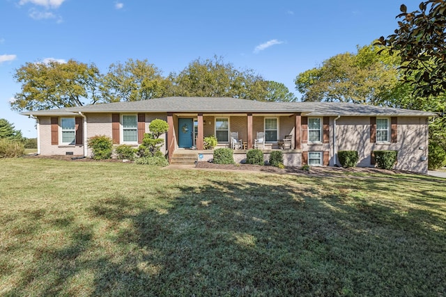 ranch-style home featuring a front lawn and covered porch