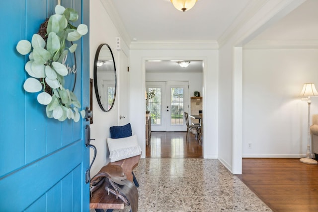 entrance foyer featuring french doors, crown molding, and dark wood-type flooring