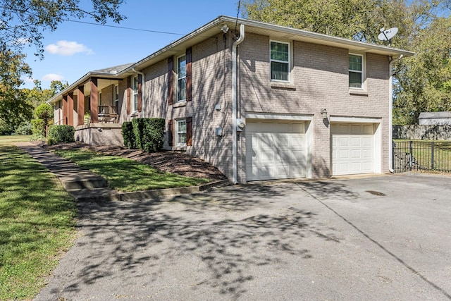 view of side of home featuring a garage