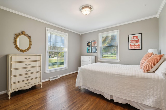 bedroom featuring crown molding, multiple windows, and dark wood-type flooring